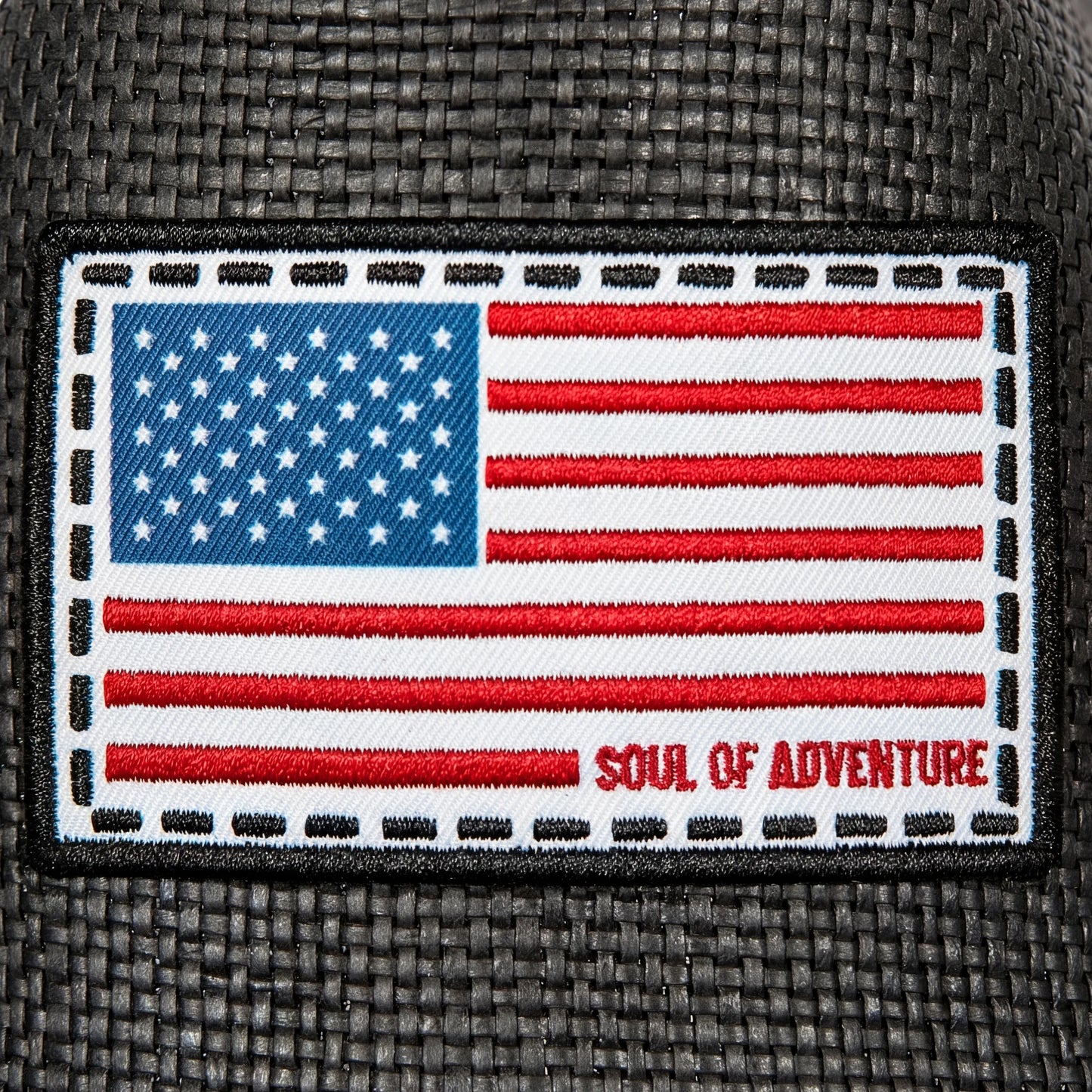 American flag patch with 'Soul of Adventure' text on a textured surface