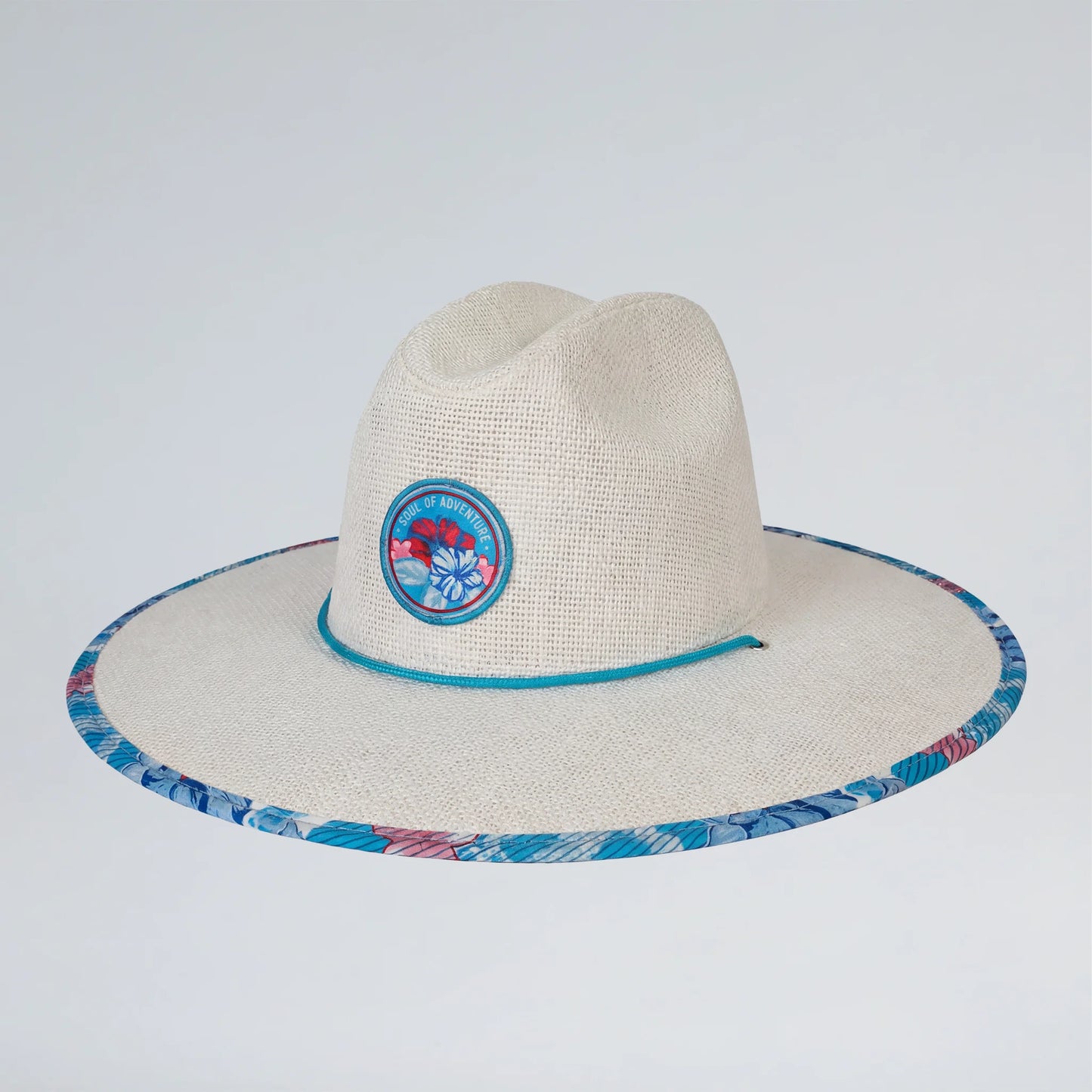 white straw hat with circular emblem on a blue background
