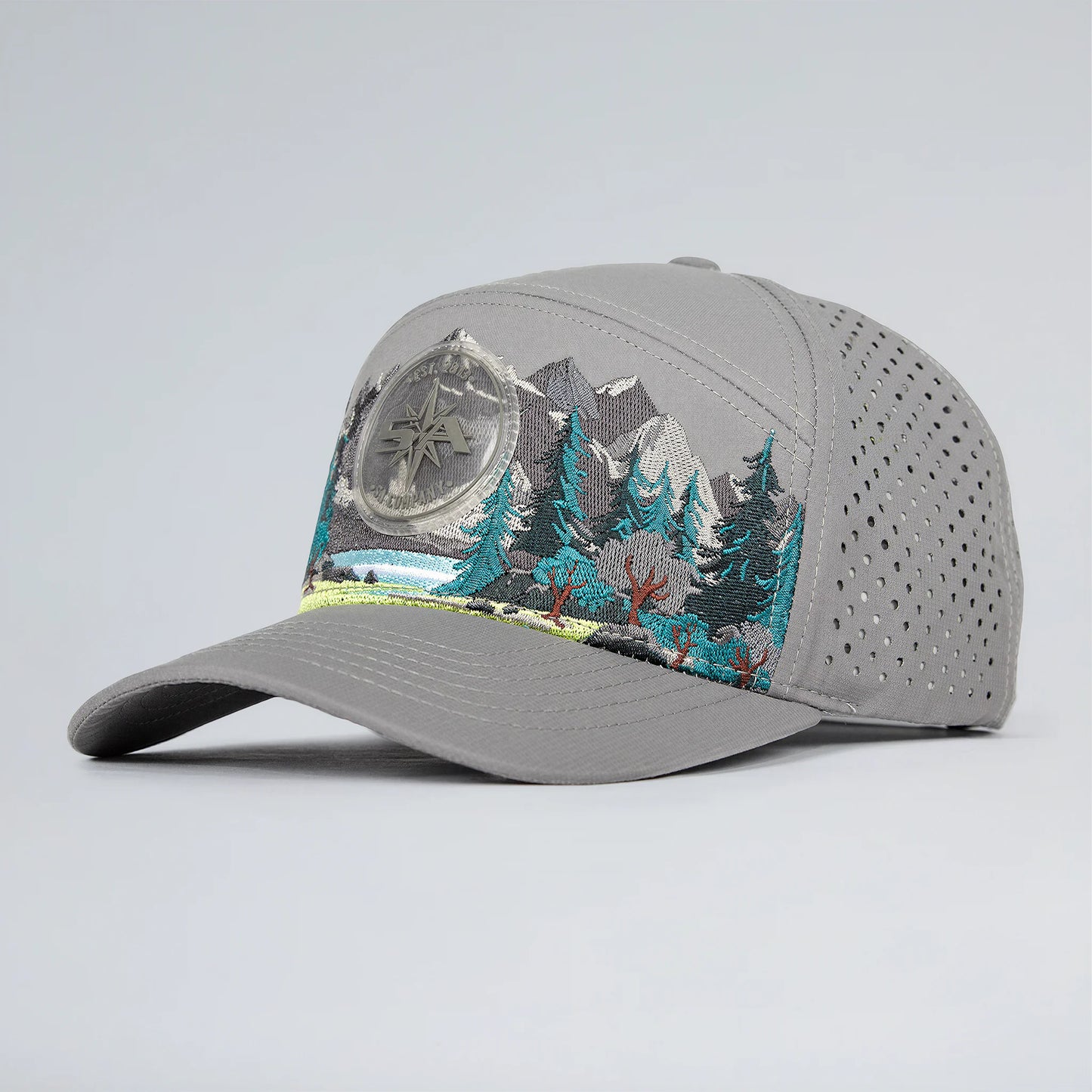 Gray cap with mountain and compass design on a light gray background