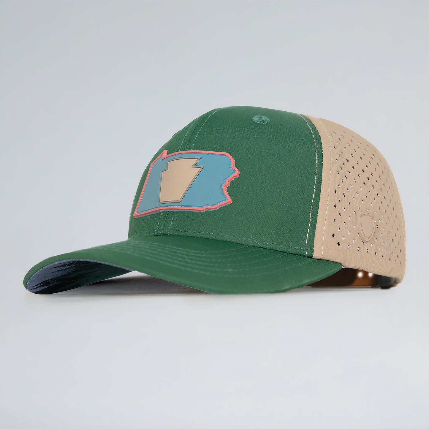 Green and beige baseball cap with a logo on a light gray background