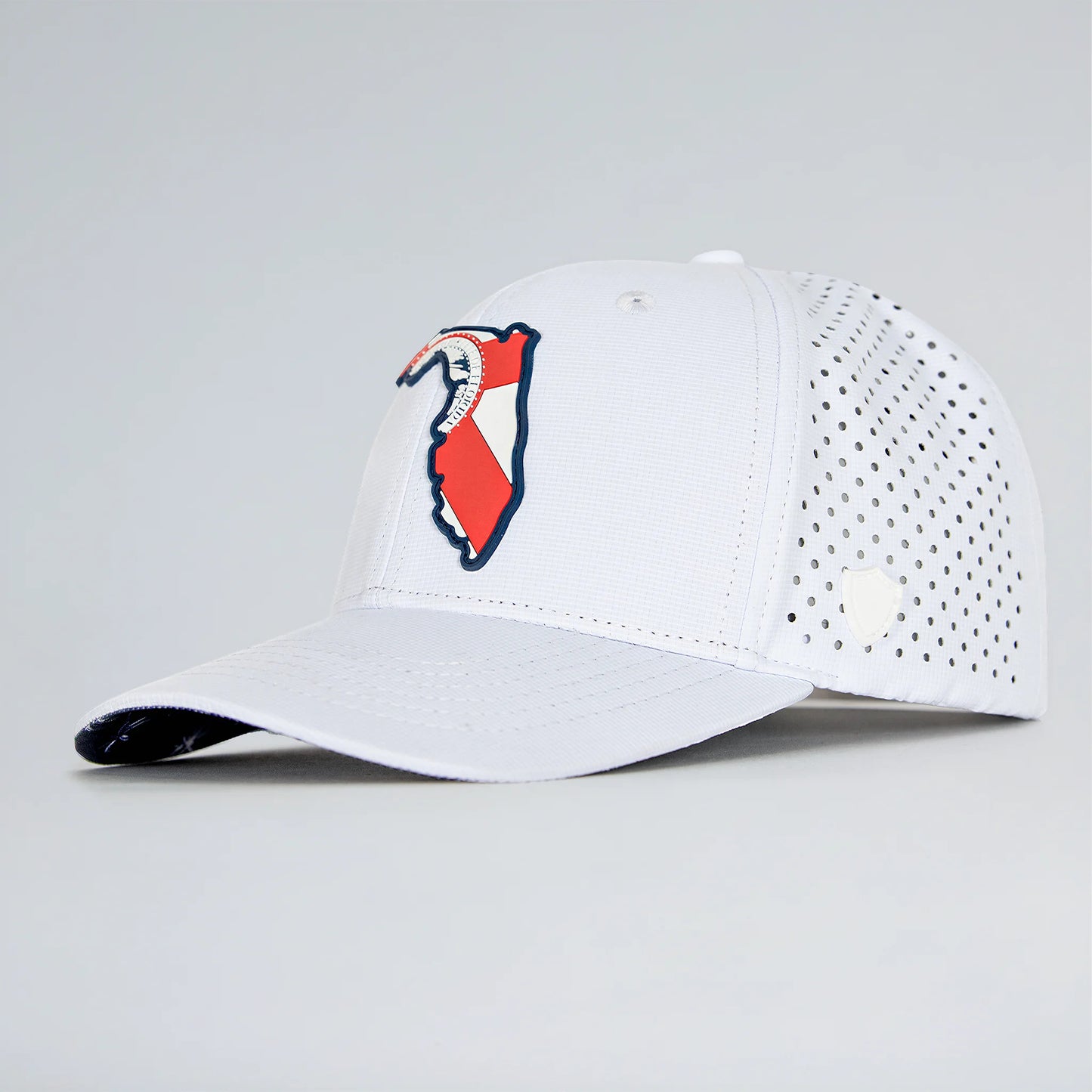 White baseball cap with a red and blue logo on a light gray background