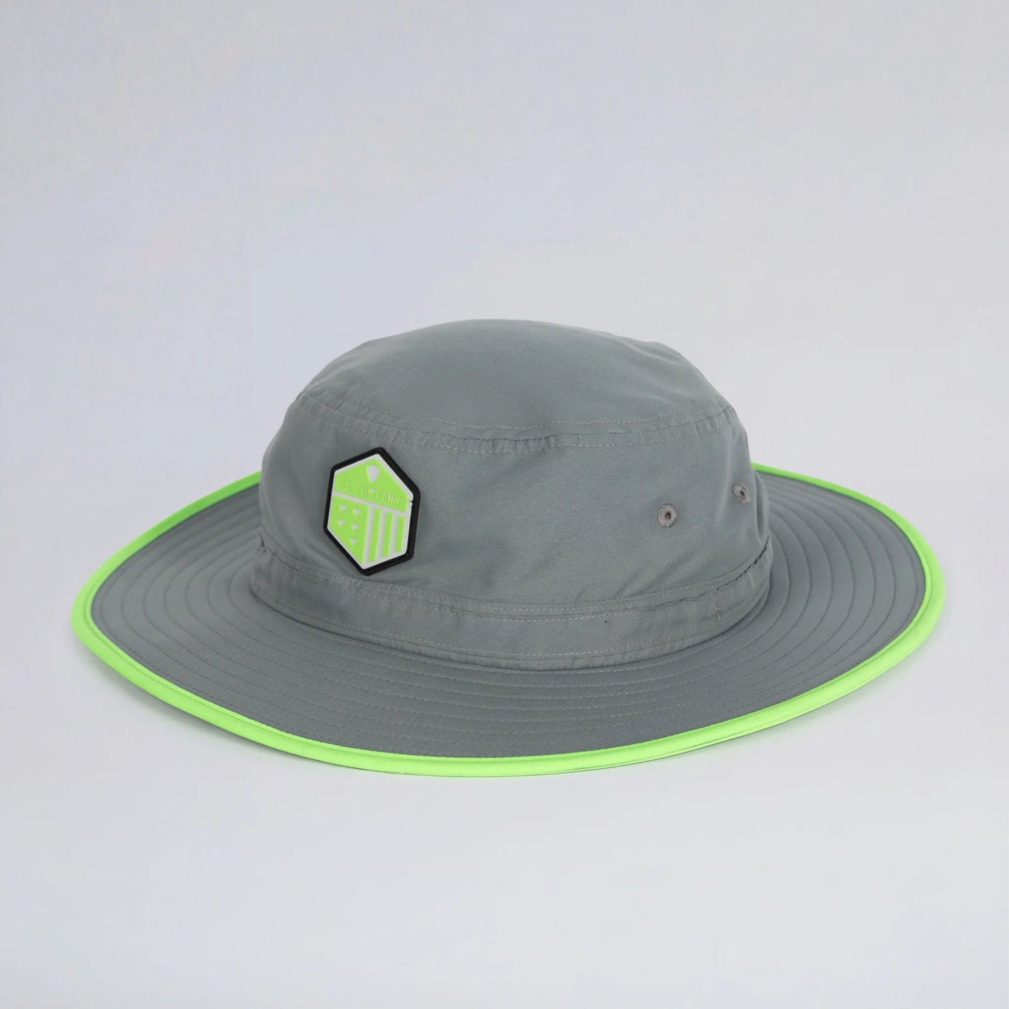 Gray bucket hat with green rim and logo on a light gray background