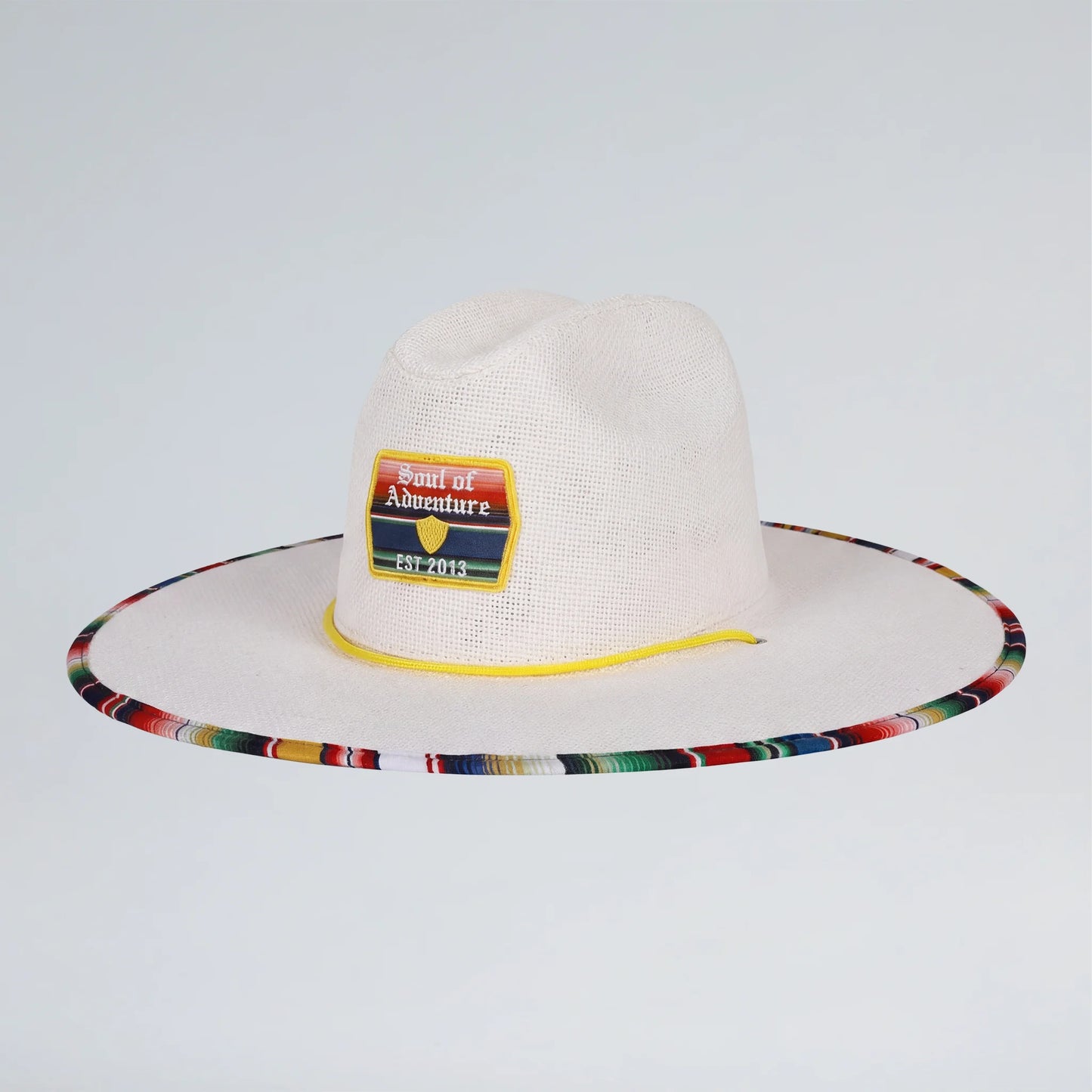 white straw hat with a colorful rim and yellow adjustable strap
