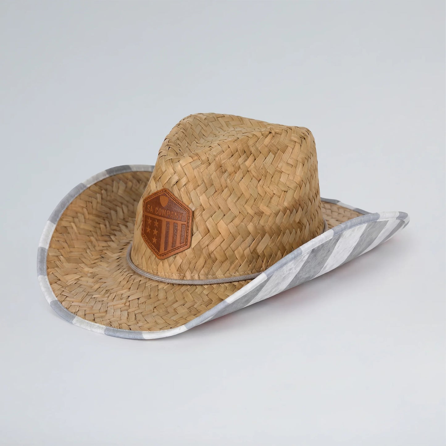Straw hat with a logo on a light gray background
