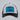 White and black Fintech trucker hat with blue United By Fishing patch on a light gray background