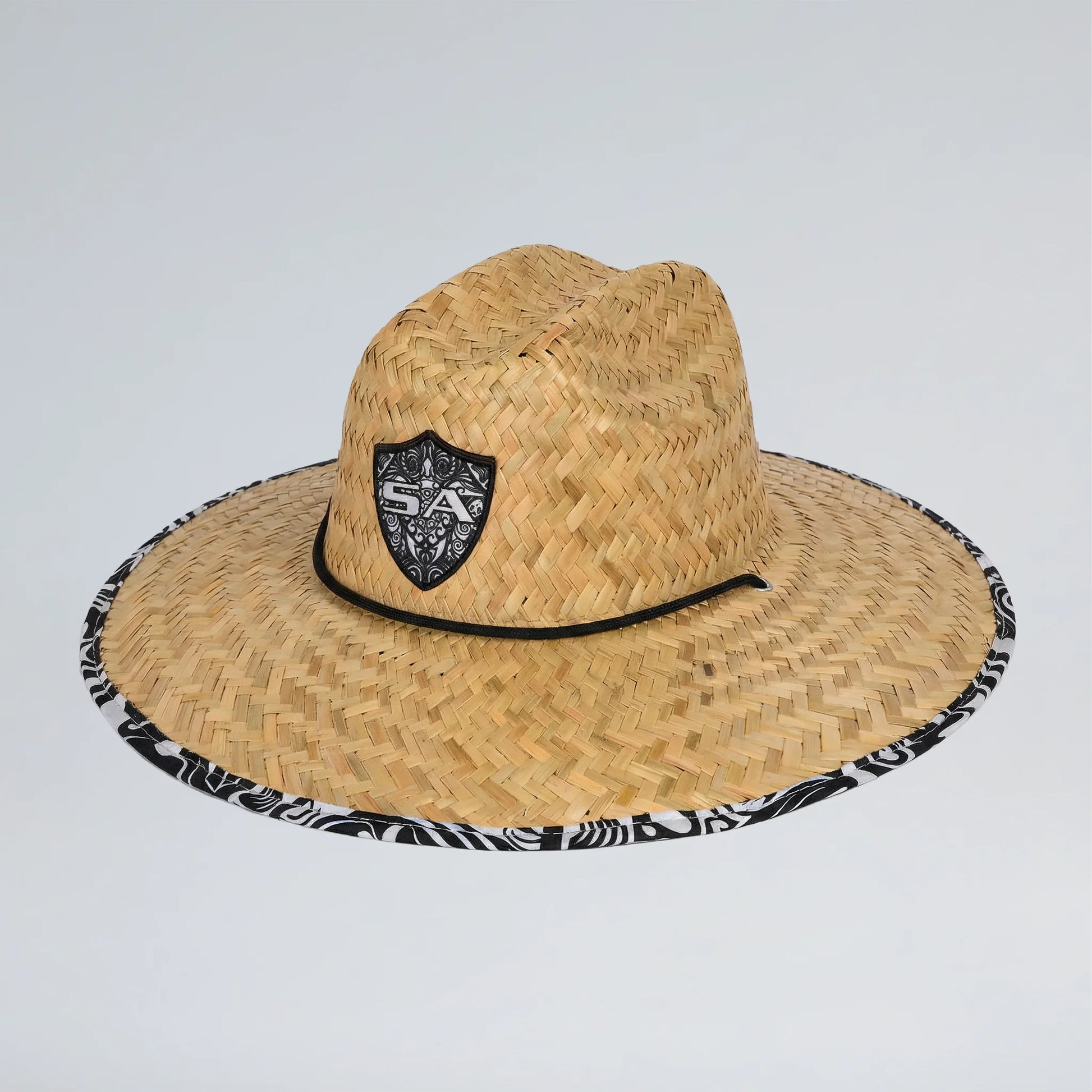 Straw hat with a black emblem on a light gray background