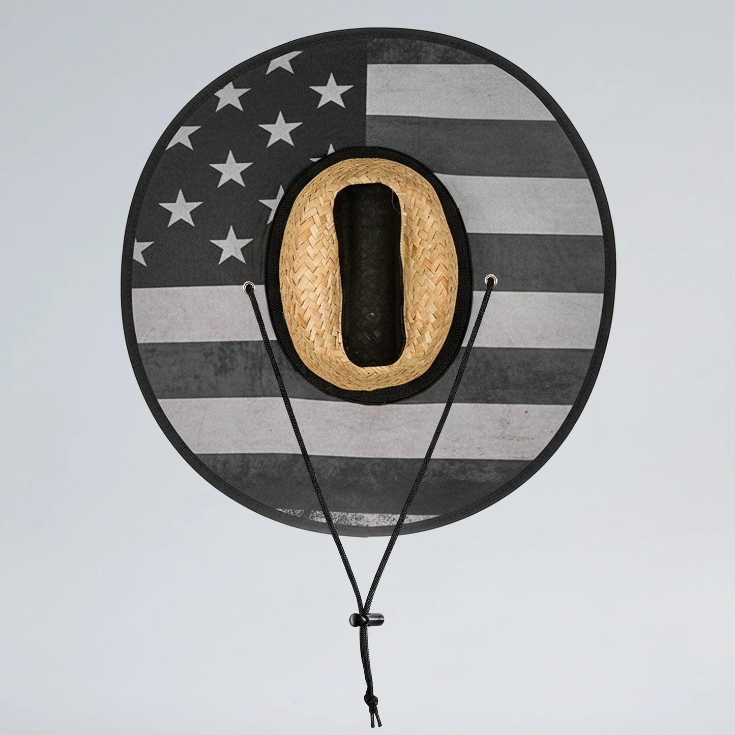 Round hat rack with American flag design holding a straw cowboy hat on a light gray background