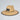 Straw hat with a black band and logo on a light gray background