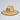 Straw hat with a USA flag logo on a light gray background