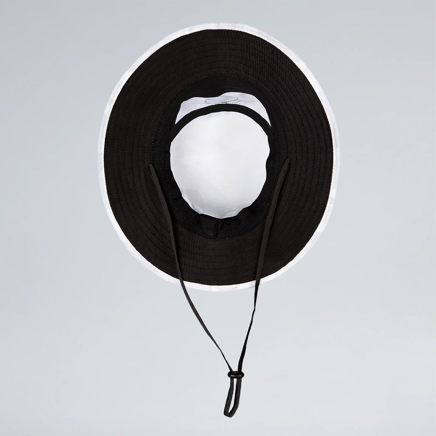 Black wide-brimmed hat with a strap on a light gray background