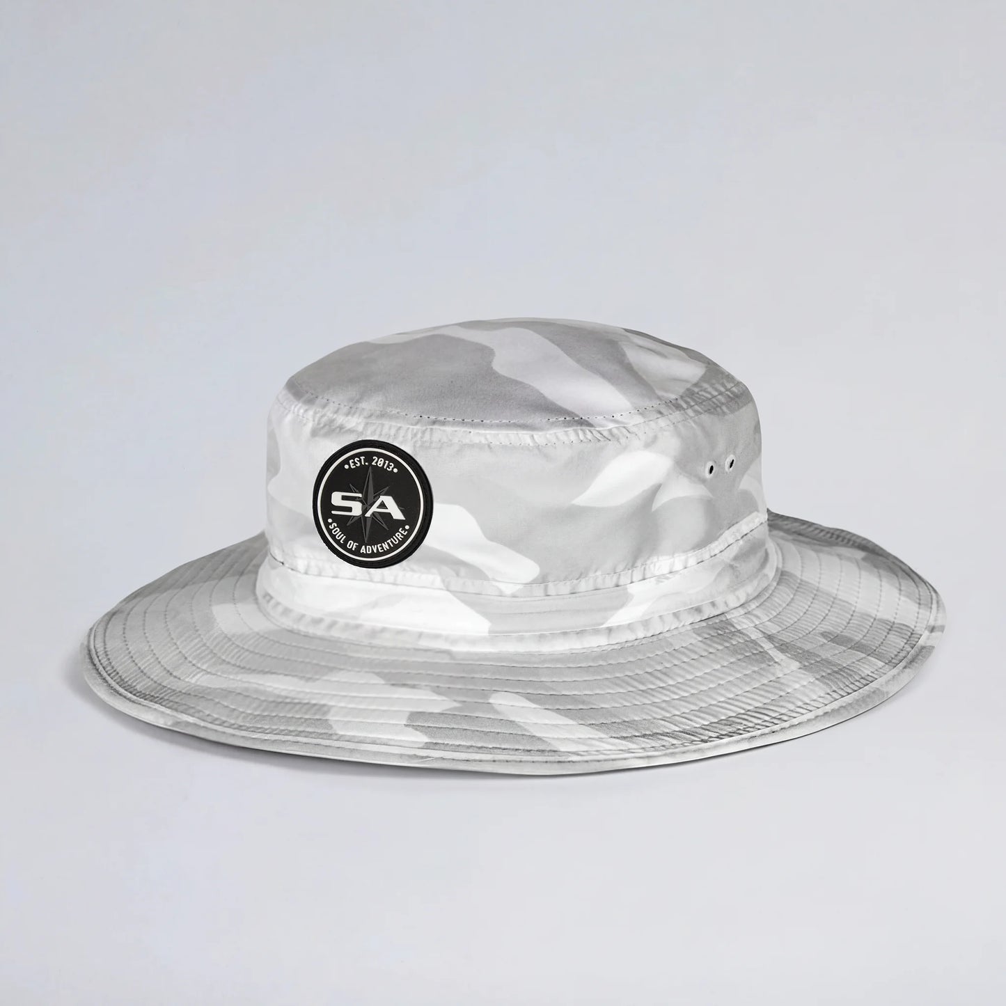 Clear camouflage bucket hat with a logo on a light gray background