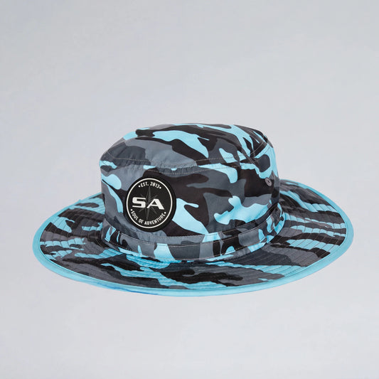 Blue and black camouflage bucket hat with a logo on a light gray background