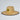 Straw hat with a logo on a light gray background