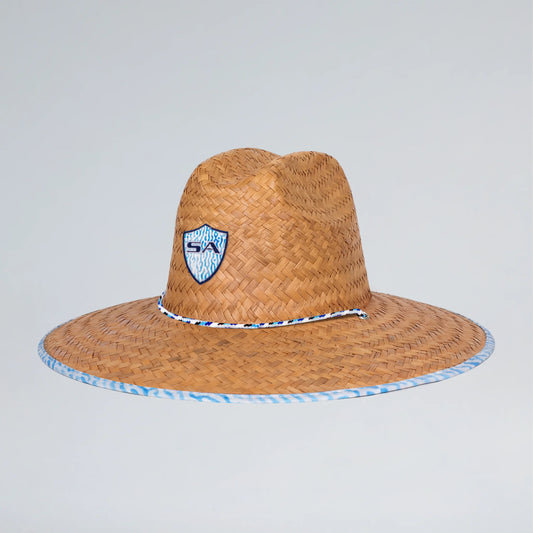 Brown straw hat with blue and white band on a light gray background