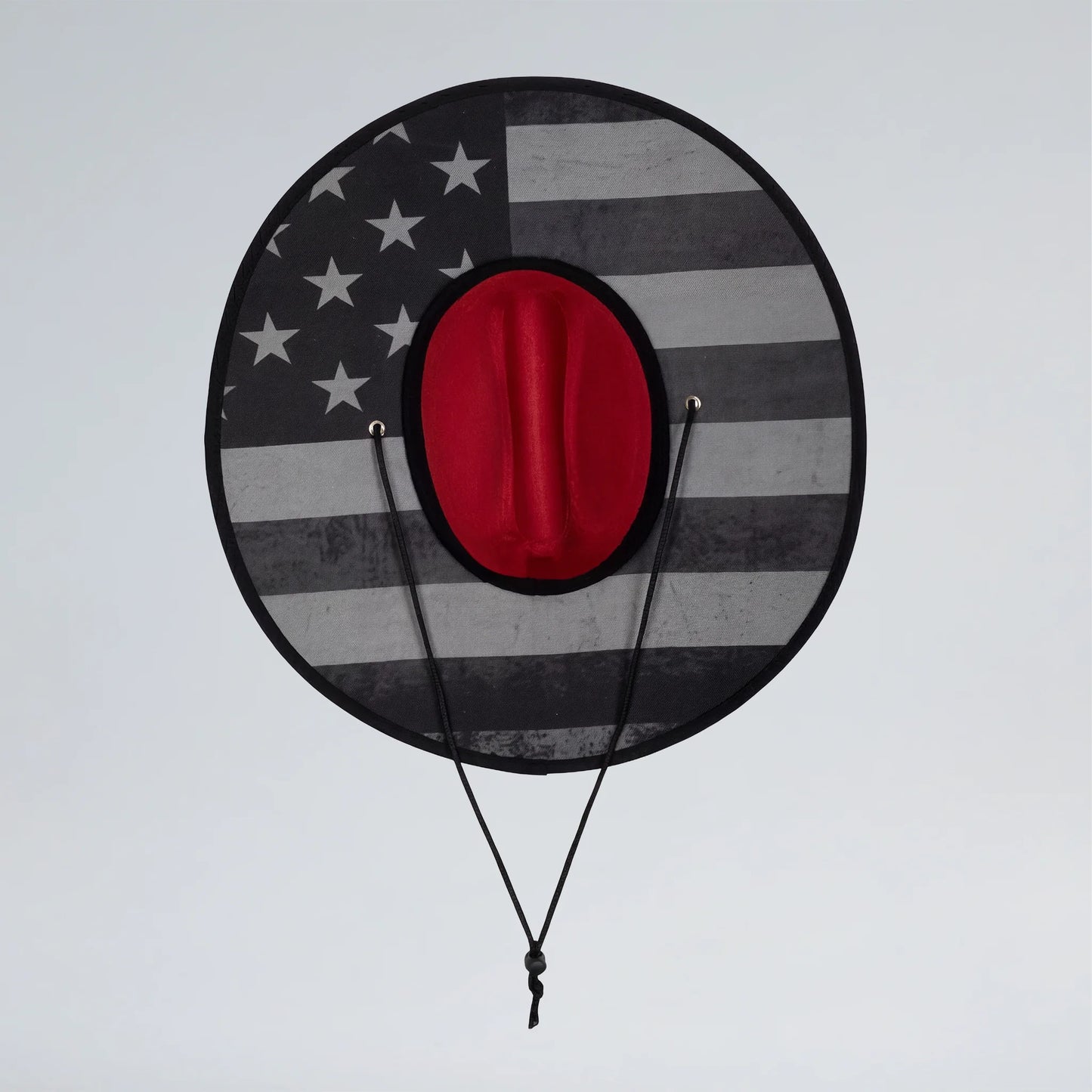 Round target with American flag design and red center on a gray background