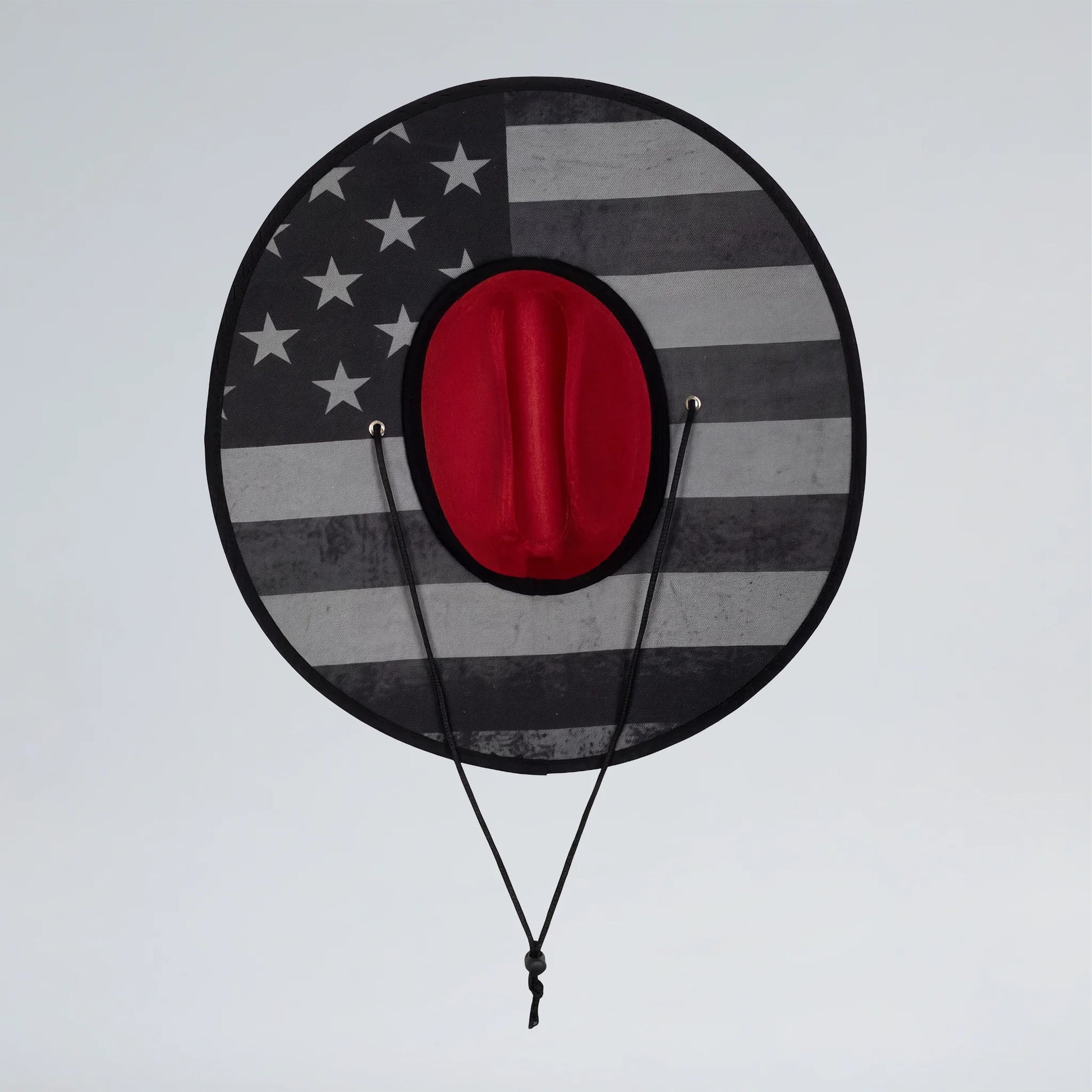 Round target with American flag design and red center on a gray background