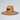 Straw hat with a logo on a light gray background