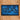 Blue patch with 'SA' letters on a woven straw hat