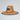 Straw hat with a blue brim and logo on a light gray background
