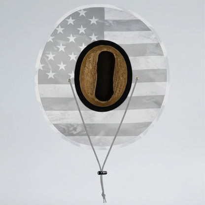 Round sign with American flag pattern and a black circle containing a brown object, on a light gray background.