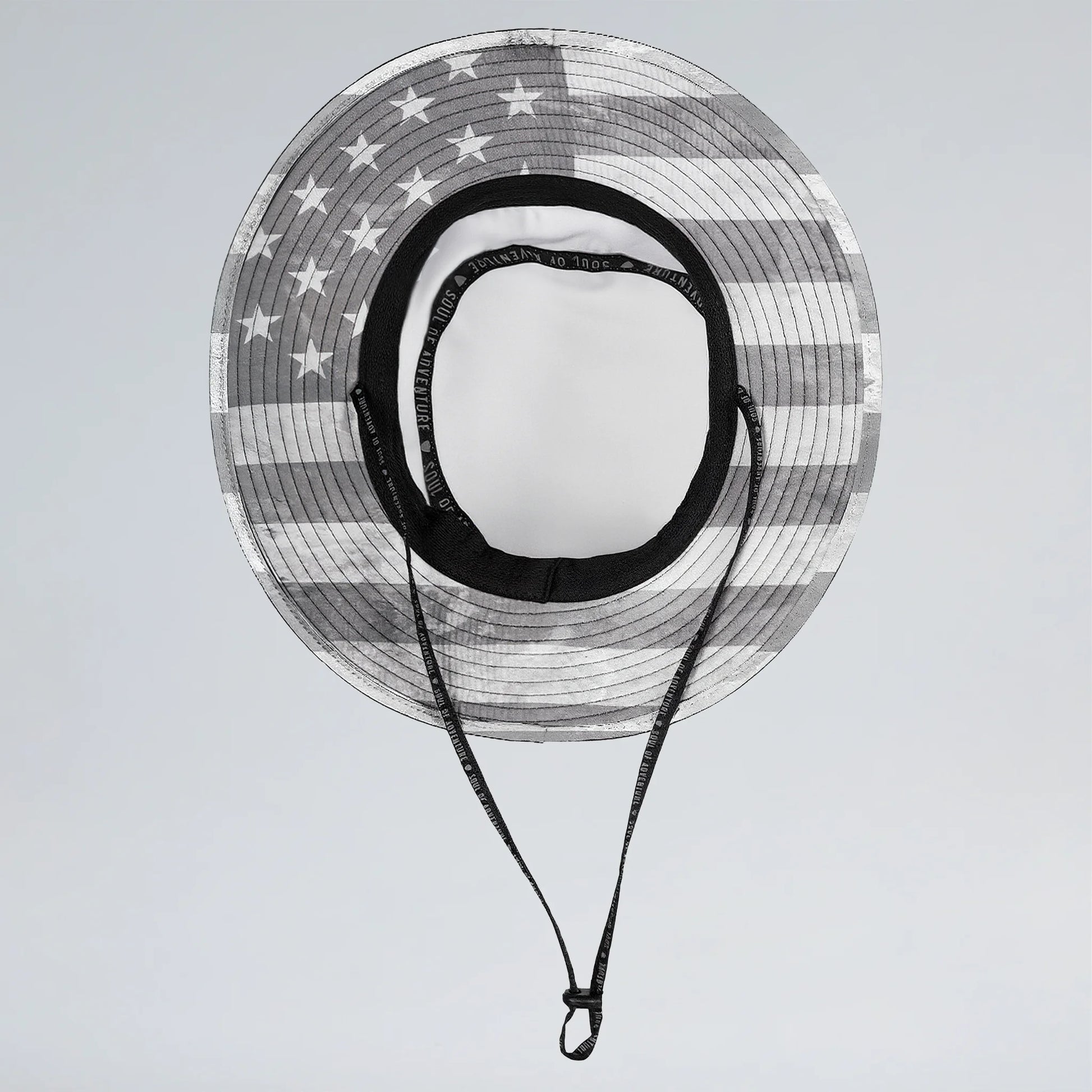 Sun hat with American flag pattern on a light gray background