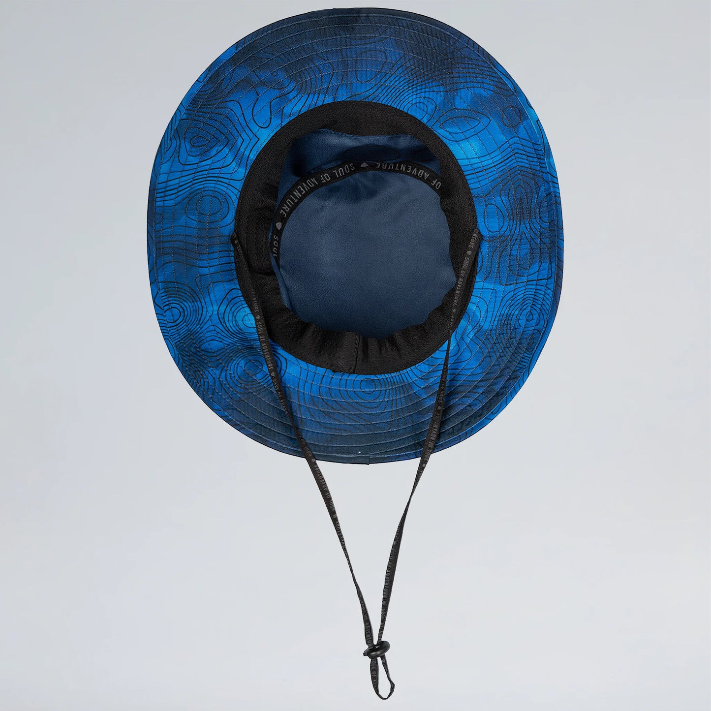 Blue patterned sun hat with black brim and chin strap on a light gray background