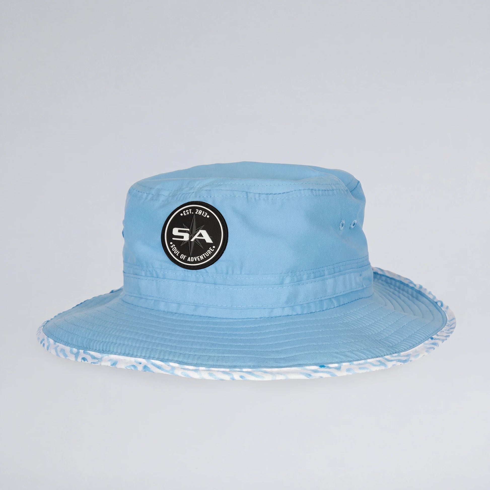 Light blue bucket hat with a logo on a light gray background