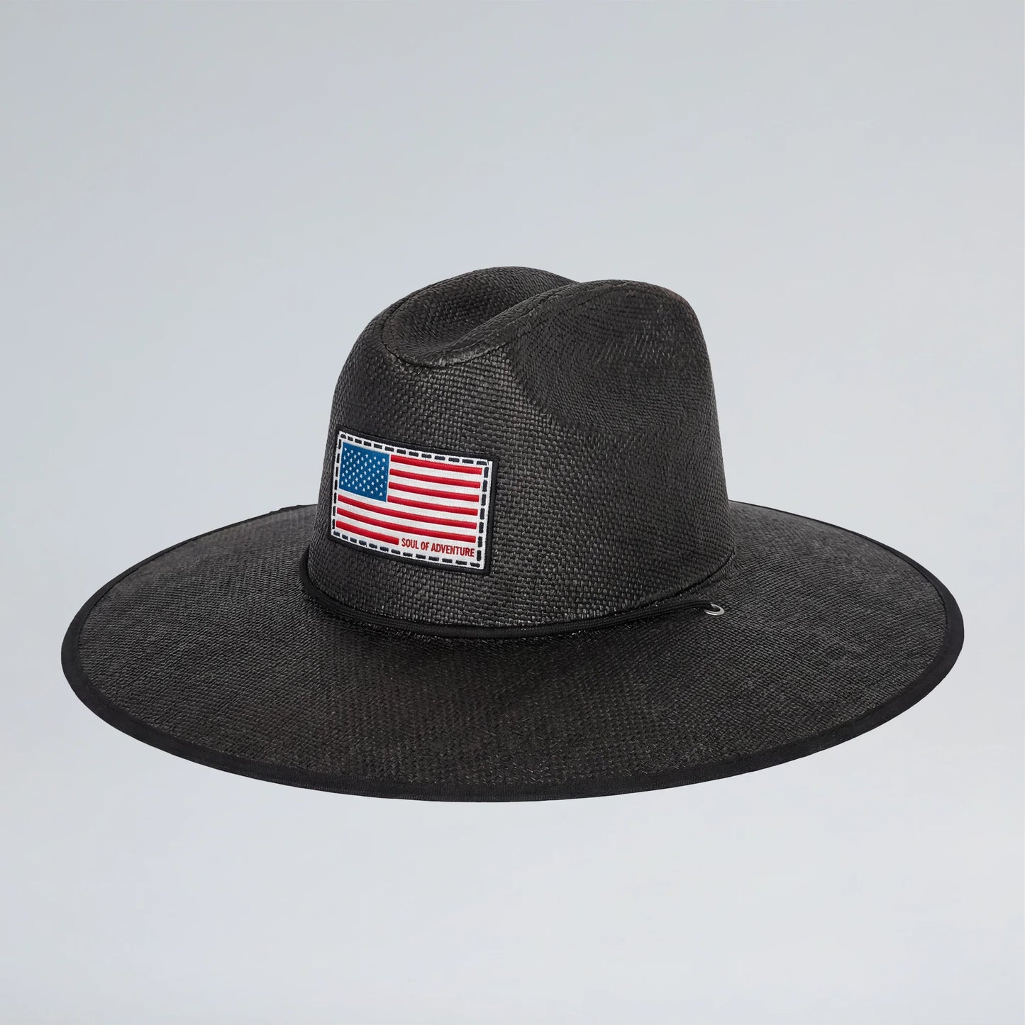 Black fedora hat with an American flag patch on a light gray background