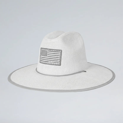 White straw hat with American flag patch on a light gray background