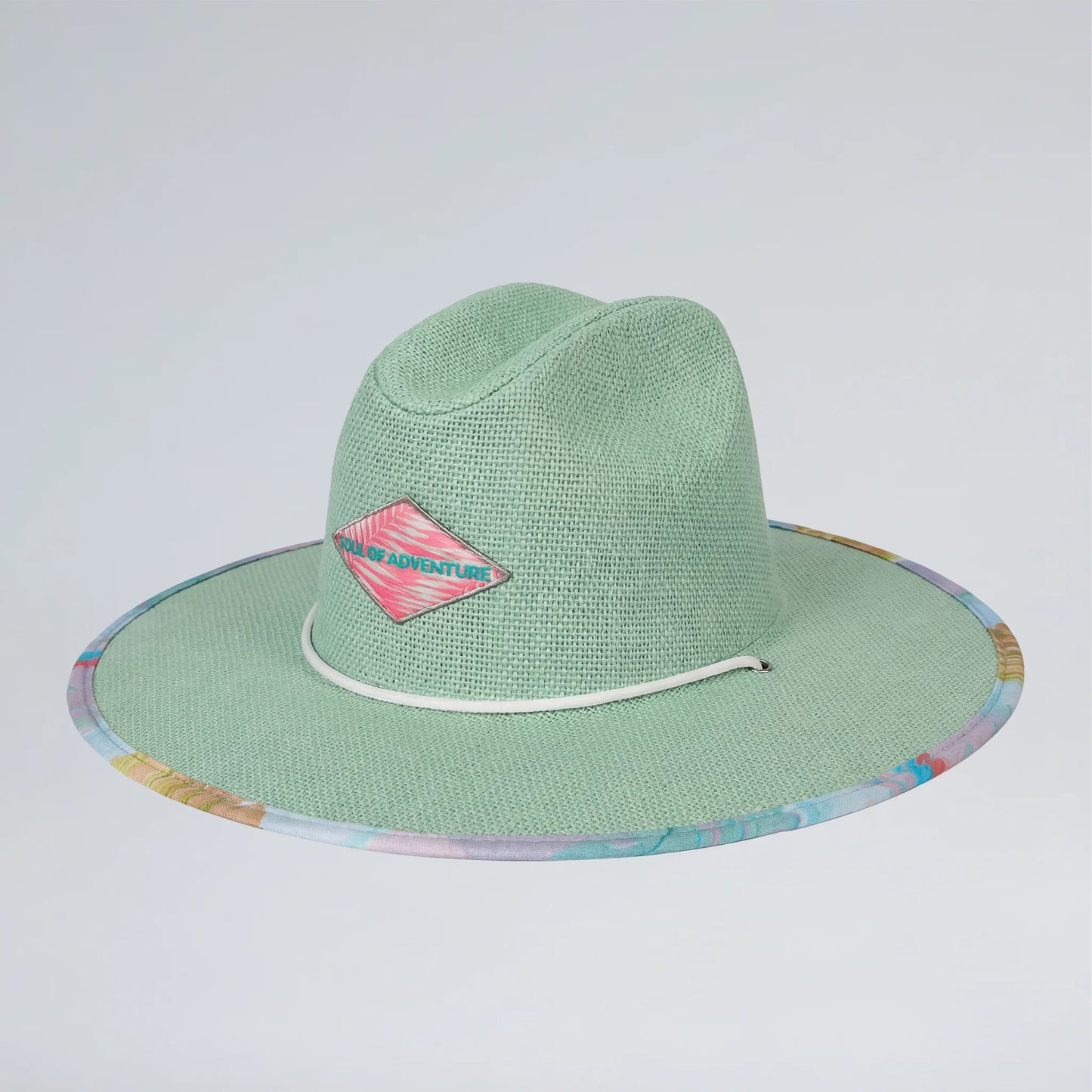 Green straw hat with colorful rim and pink logo on a light gray background