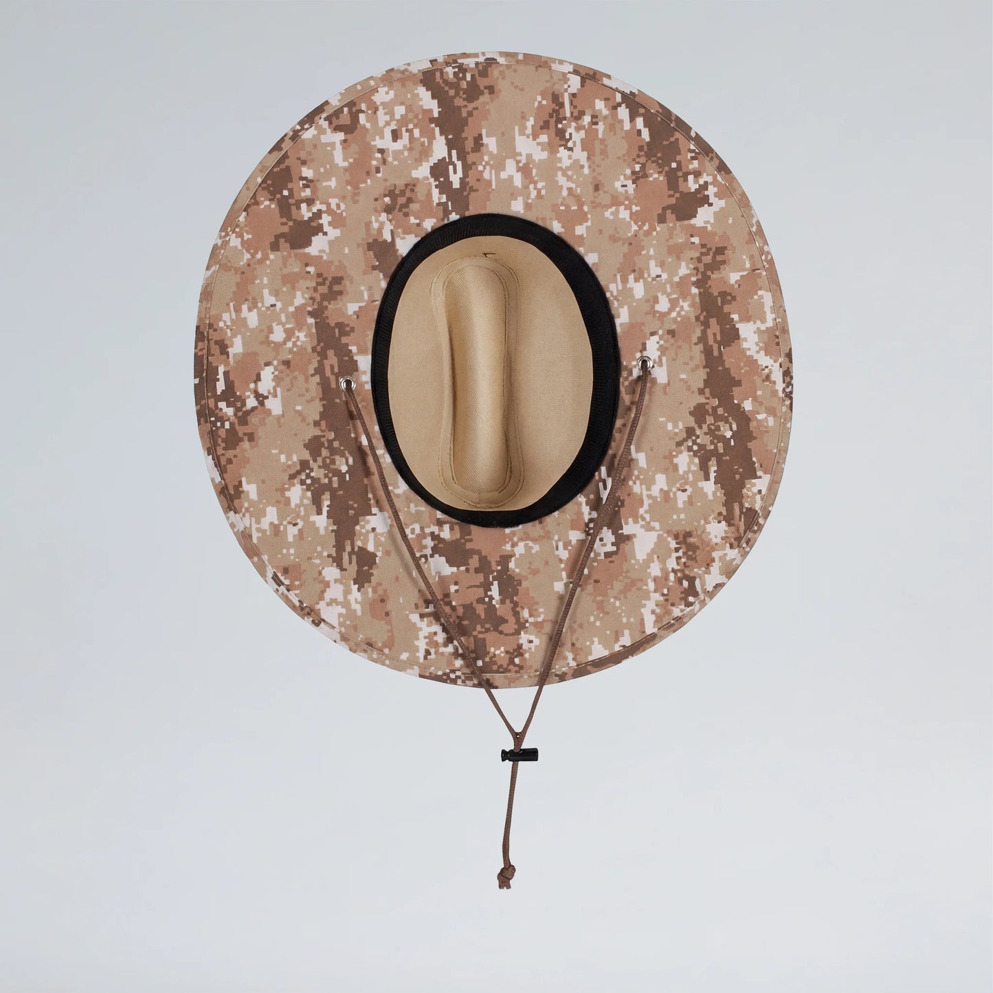 Camouflage-patterned cowboy hat on a light gray background