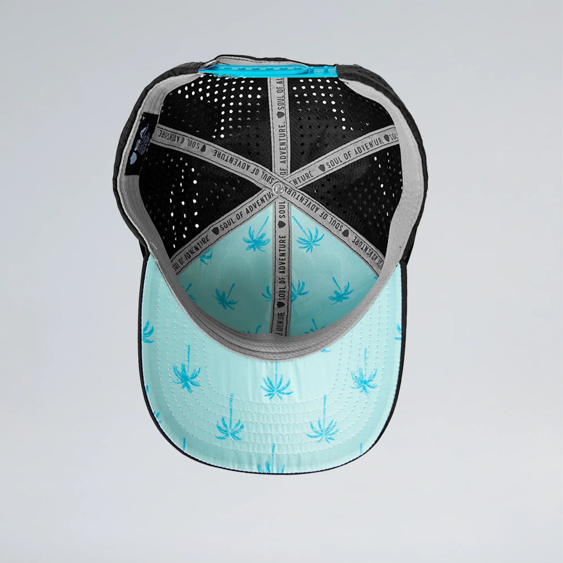 Back view of a cap with black and blue patterns on a light gray background