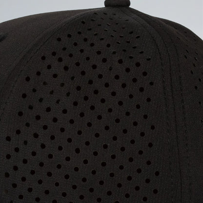 Black cap with perforated design on a gray background