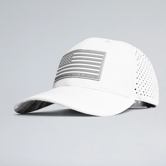 White baseball cap with an American flag patch on a gray background