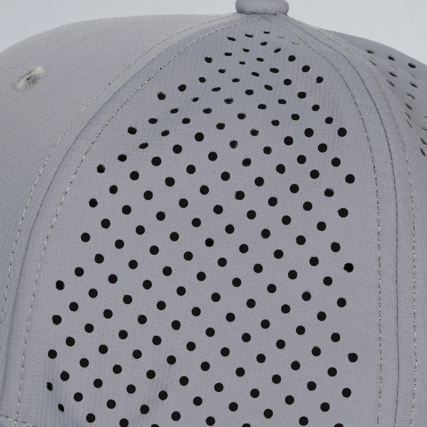 Gray cap with black perforated pattern on a light gray background