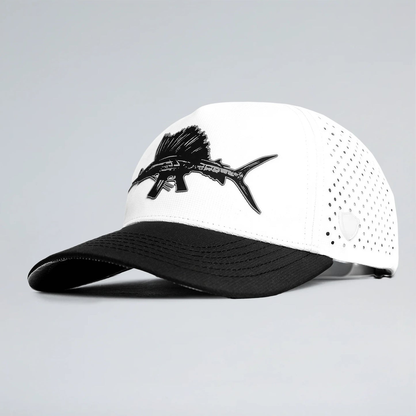 White and black cap with fish design on a gray background