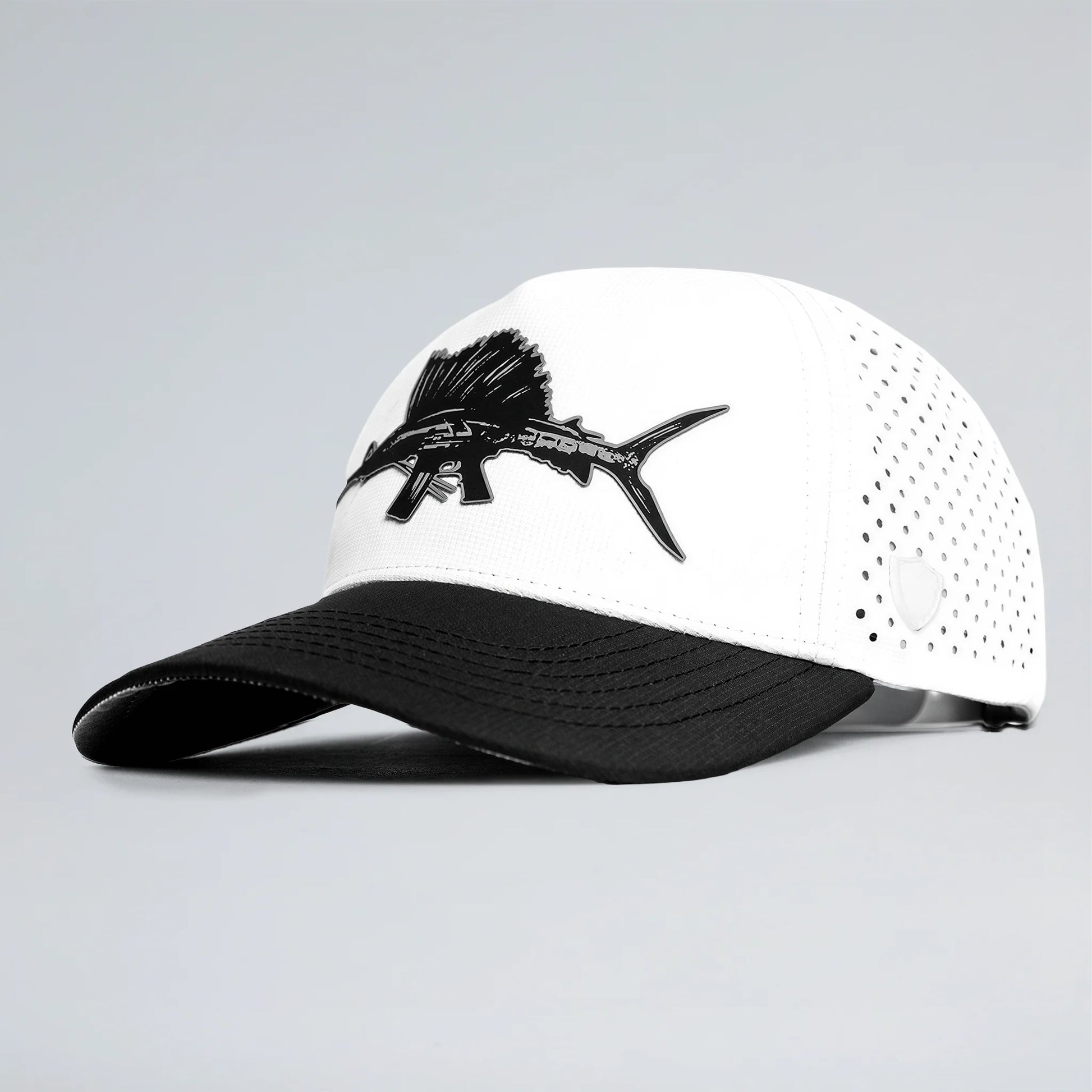 White and black cap with fish design on a gray background