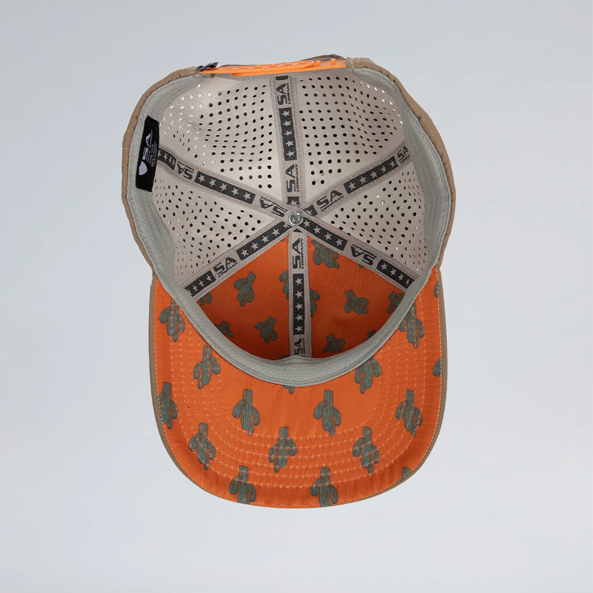 Baseball cap with orange and gray pattern on a light gray background