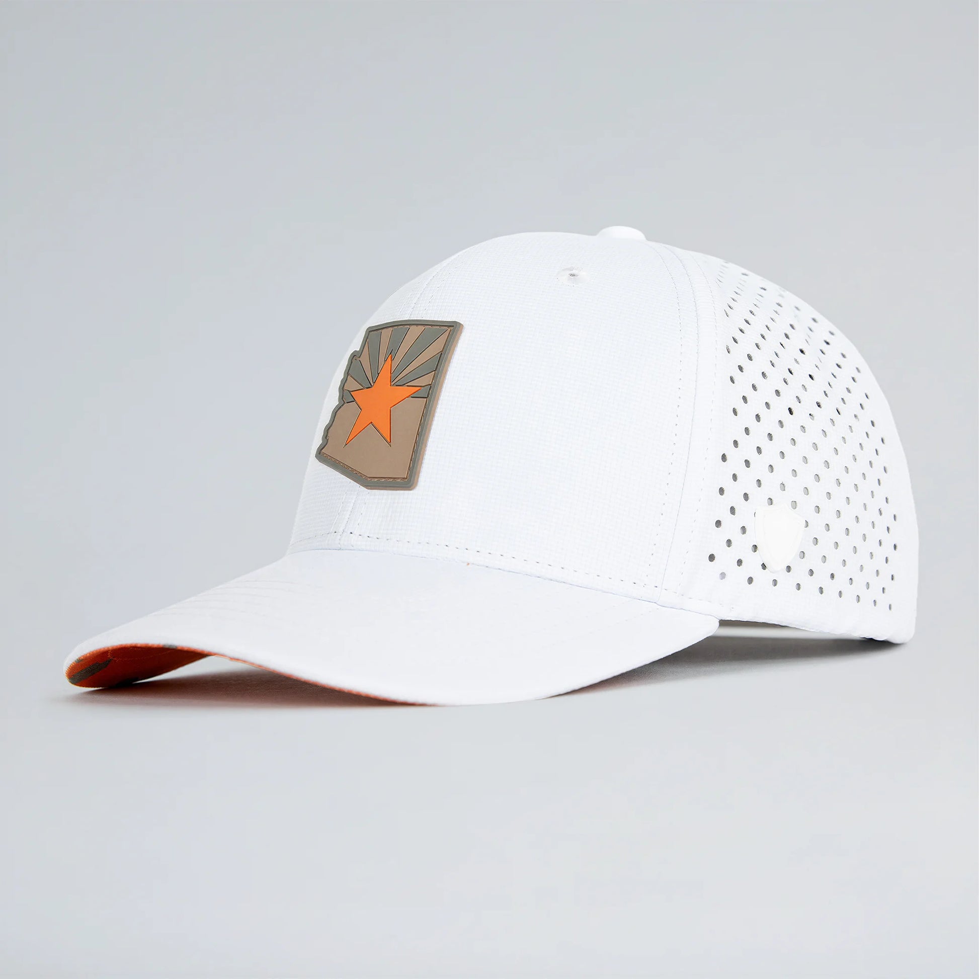 White baseball cap with a star emblem on a gray background
