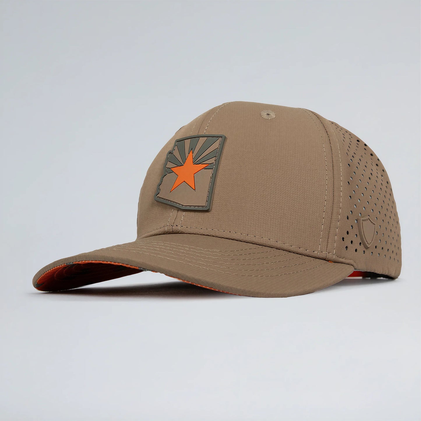 Brown baseball cap with a star emblem on a light gray background