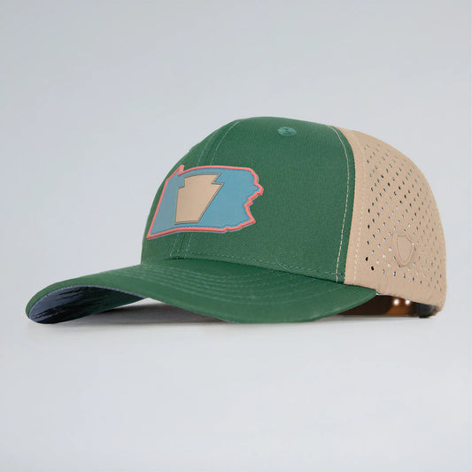 Green and beige baseball cap with a logo on a light gray background