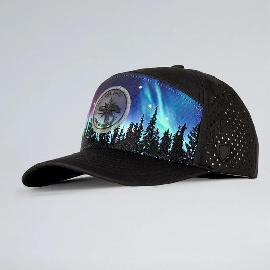 Black cap with Northern Lights design on a light gray background