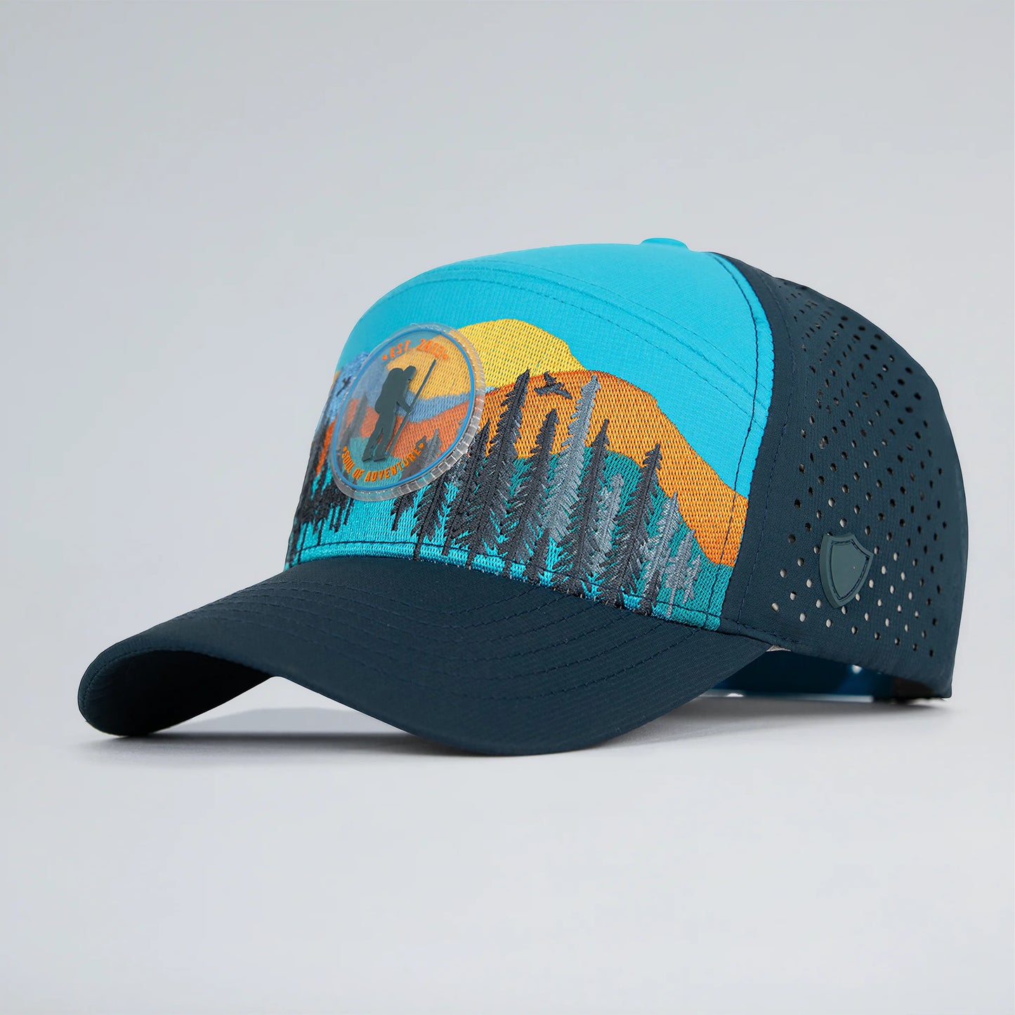 Baseball cap with nature-themed design on a gray background