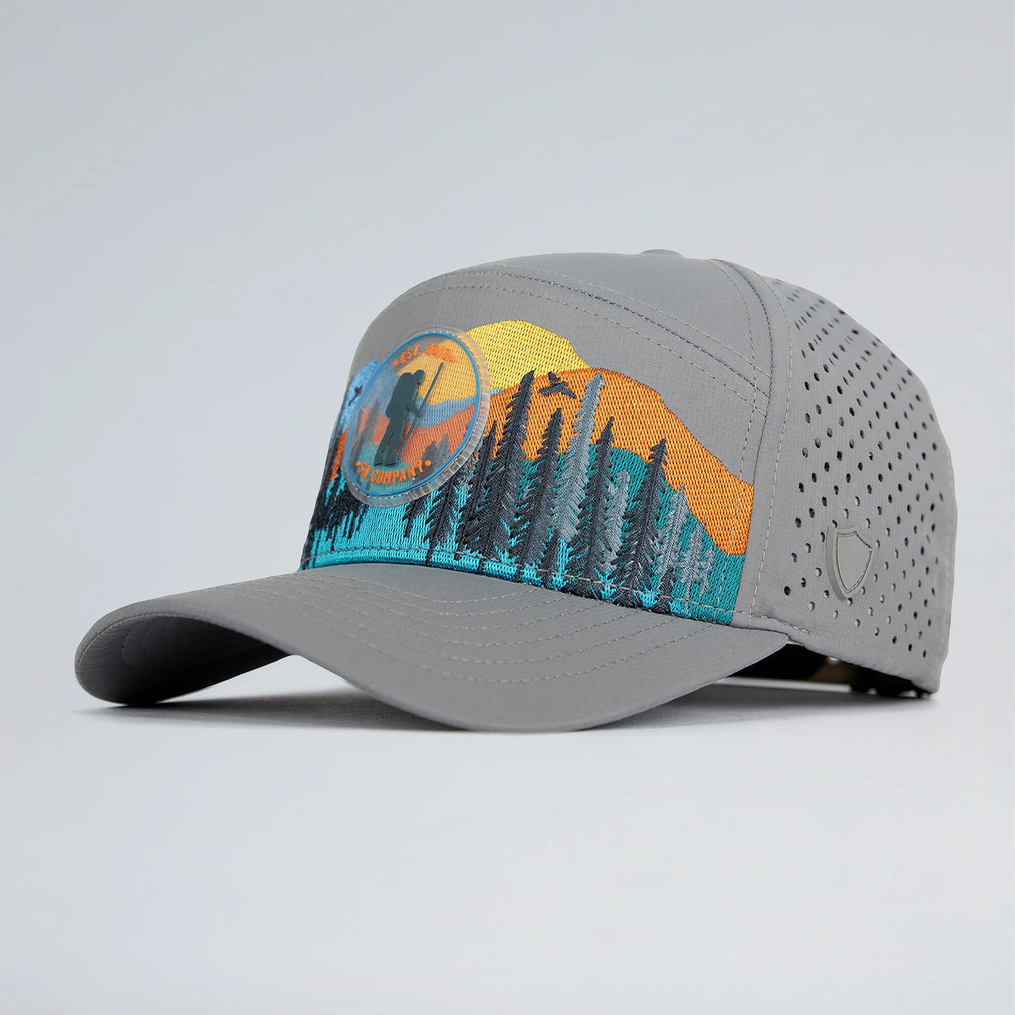 Gray cap with a scenic design on a light gray background