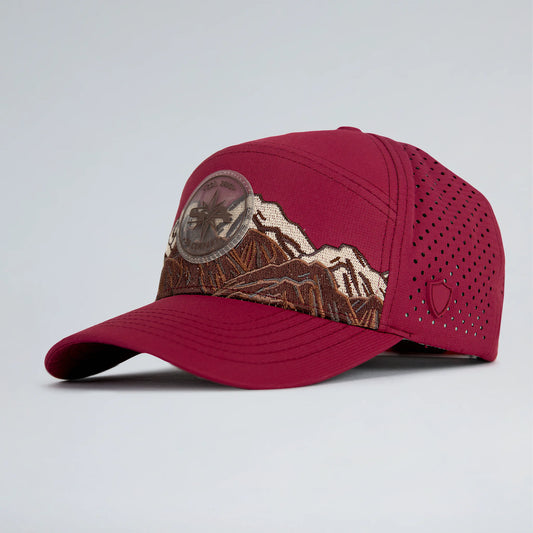 Red cap with mountain design on a light gray background