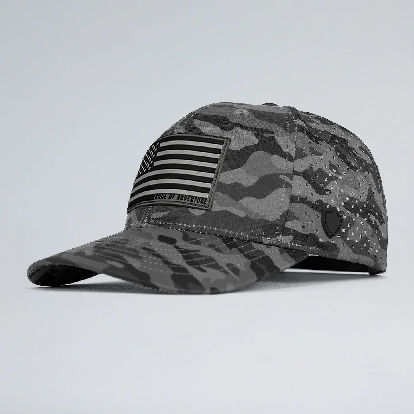Gray camouflage cap with American flag patch on a light gray background