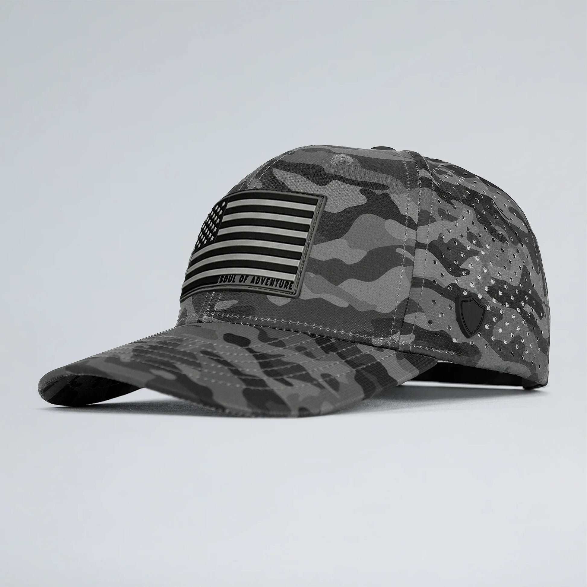 Gray camouflage cap with American flag patch on a light gray background