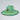Green straw hat with a circular emblem on a light gray background