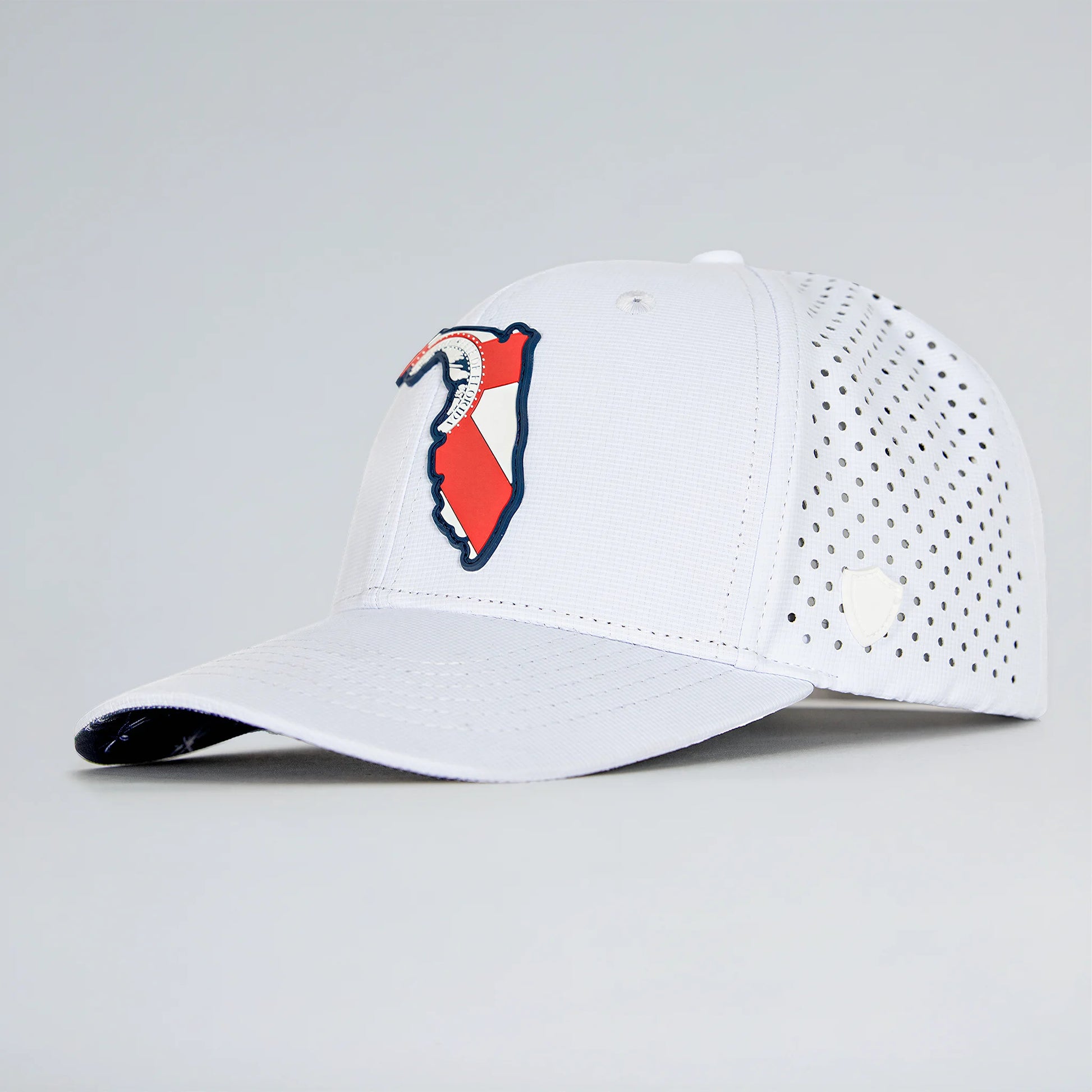 White baseball cap with a red and blue logo on a light gray background