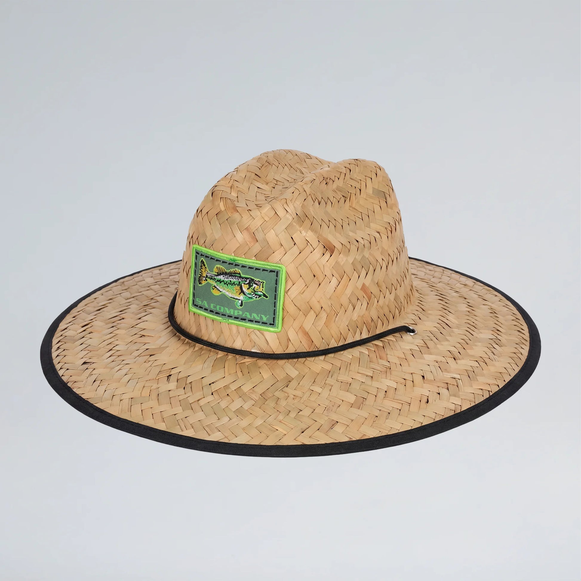 Straw hat with a green patch featuring a fish design on a light gray background